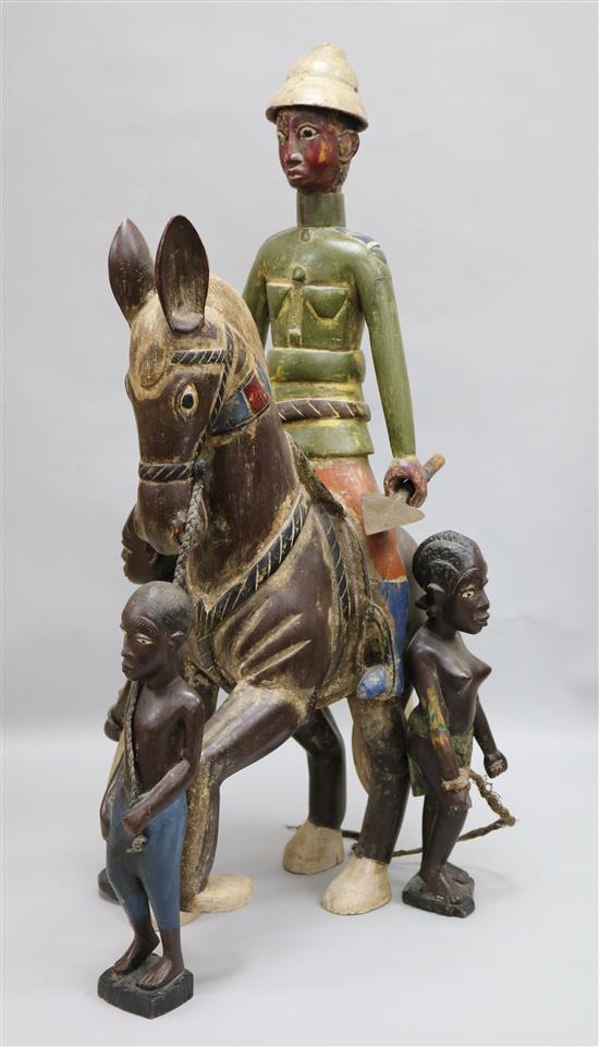A carved horse with a figural group of slaves, H.65.5cm